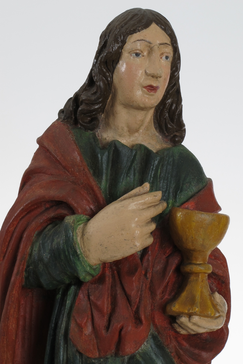 Døperen Johannes, stående mannsfigur, kalk (drikkebeger på stett), i hånden