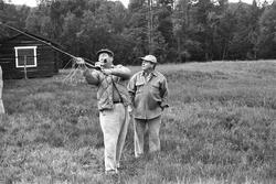 Landskap med person(er).