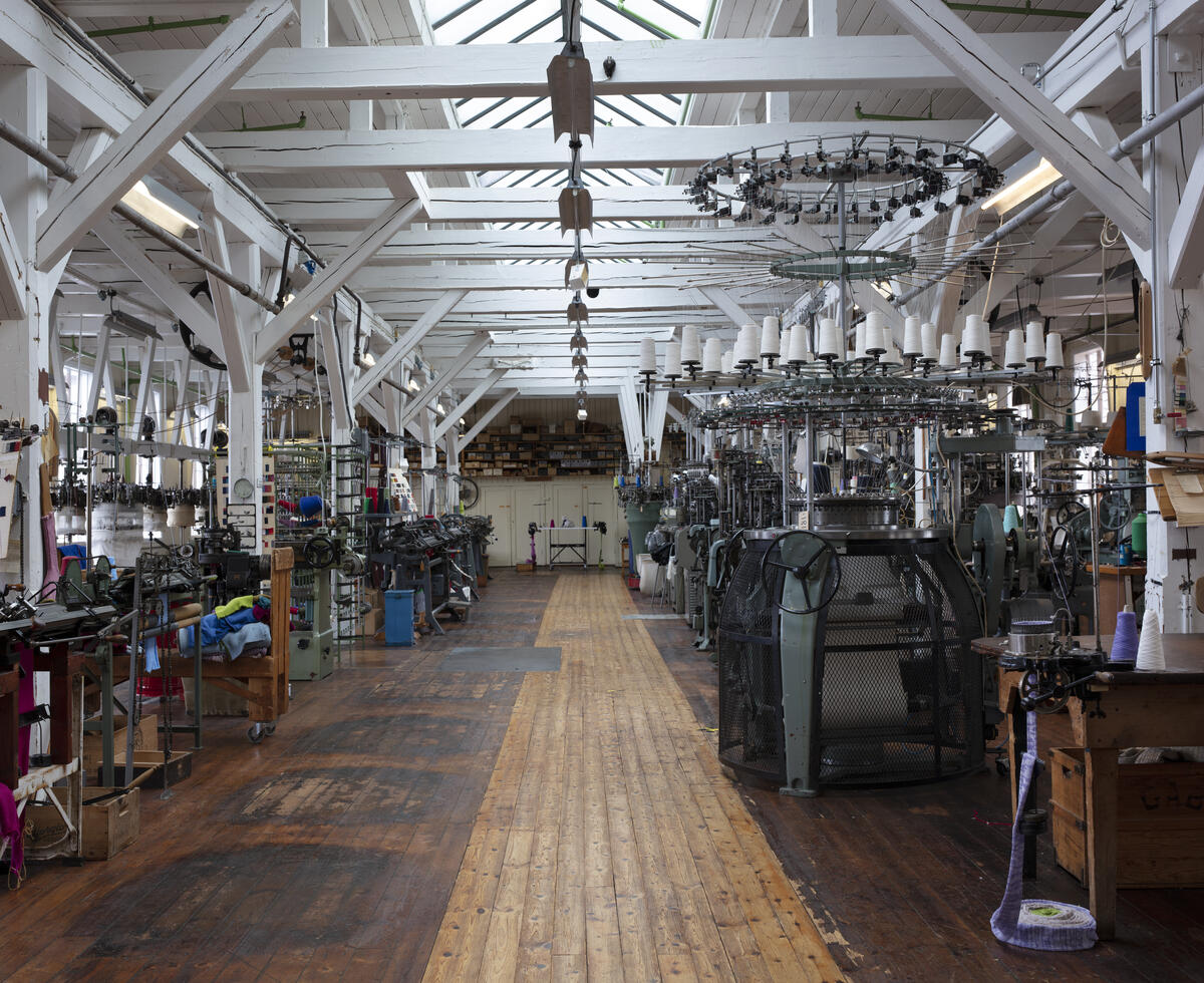 knitting machines in old textile mill interior