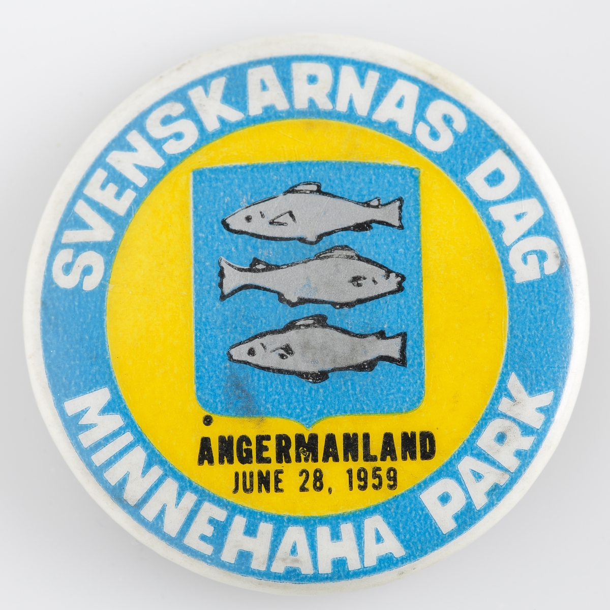 Nålmärke "Svenskarnas dag Minnehaha Park" från år 1959 och med Ångermanlands länsvapen.