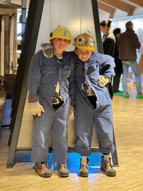 Photo shows children wearing the coal miner's outfit.