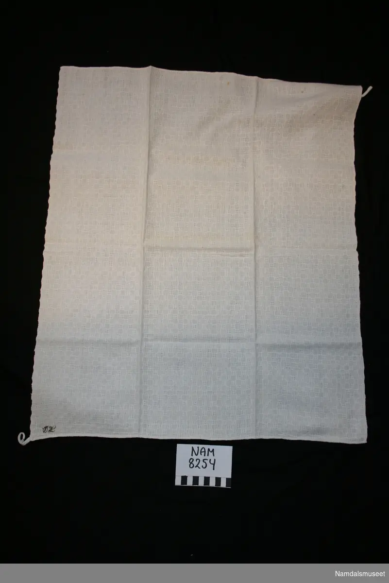 Rektangulært håndkle med brodert monogram