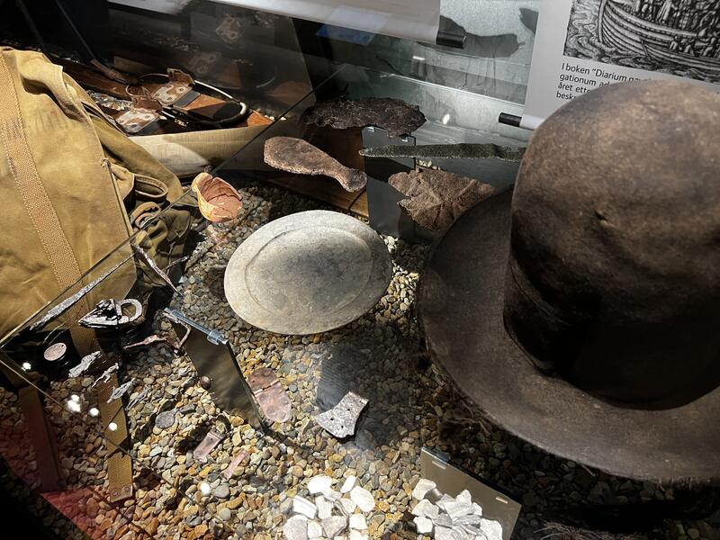 Photo shows a hat and other objects.