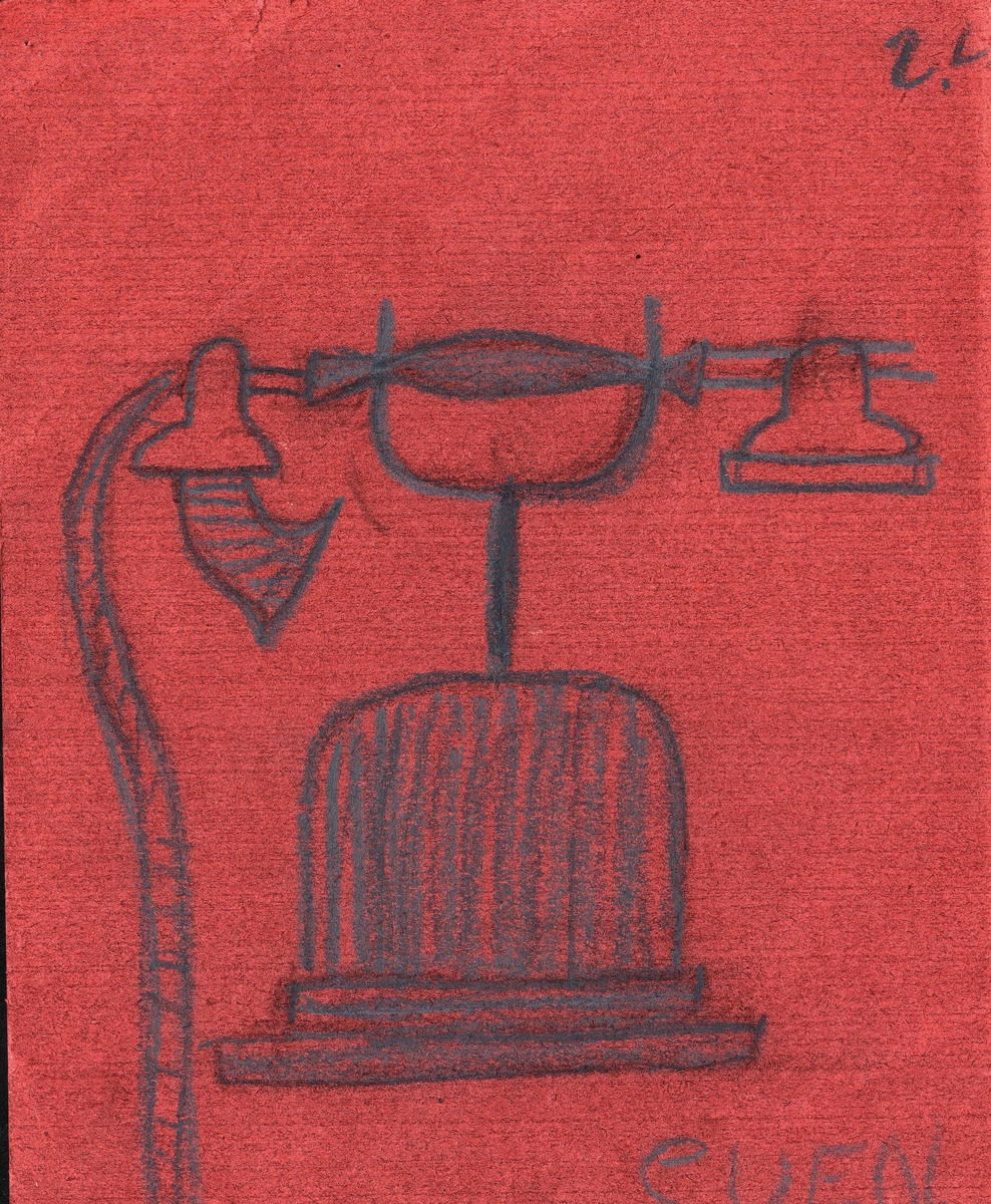 En telefon i svart krita på röd kartong.