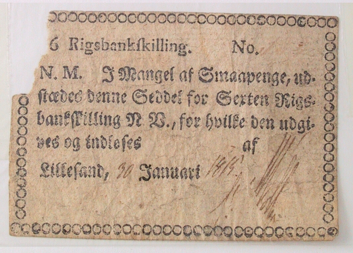 Gotisk trykk. Ramme bestående av ringer. Øverst 16 Rigsbankskilling. Datert Lillesand 30.Januari 1815.