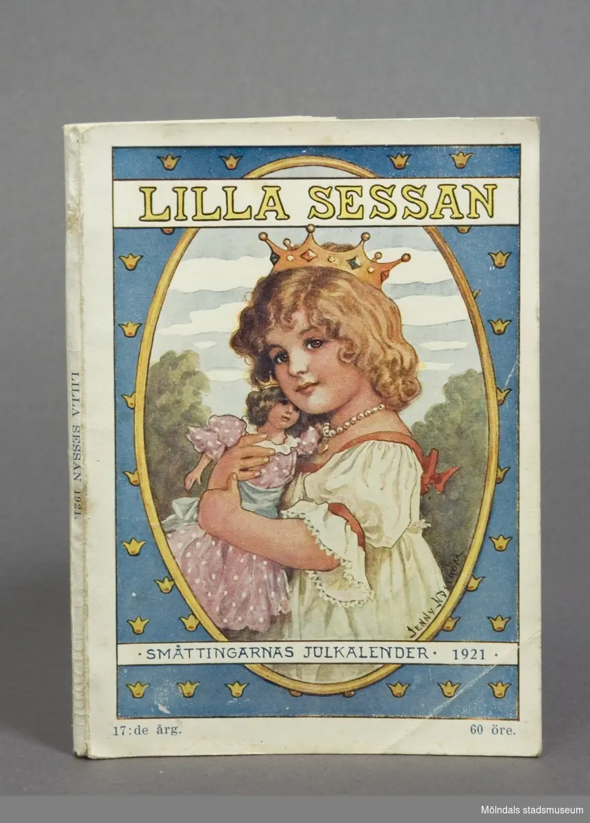 Boktitel: "Lilla Sessan". Barnens julkalender, sagor och berättelser med illustrationer. Utgiven av Julklockans Redaktion 1921.