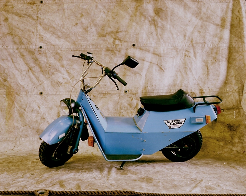 Silentia Electric är en elmotordriven scooter som lanserades 1988. Den självbärande karossen är gjord av helsvetsad stålplåt och scootern är utrustad med en hydraulisk skivbroms på framhjulet samt trumbroms på bakhjulet. Framhjulsfjädringen är av Earles-typ, och scootern har en automatväxel med tre hastigheter. Scootern drivs av ett 12V elmotor och 12V batteri och har kedjedrift. Högsta fart är ca 60 km/timmen och scootern väger 85 kg. Ortenheims patenterade automatiska återladdningssystem gör att elmotorn fungerar som generator i nedförsbacke eller under decceleration, och laddar batteriet. Prov som utfördes av Teknikum vid Uppsala Universitet på Ortenheims Silentia Electroped 24, en liknande modell i mopedutförande, visade att återladdningssystemet ger ca 28 % energiåtervinning. Electroped 24 körde under provet en sträcka av 77 km innan batterierna var slut.