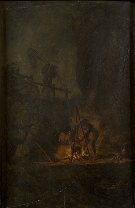 Män vid en eld i en bergsklyfta