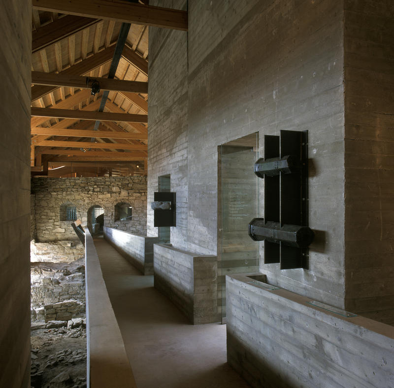 A concrete ramp is crossing through the entire museum making sure the medieval ruins are not worn down from people walking, and fragments of medieval canons are on display on one of the walls.