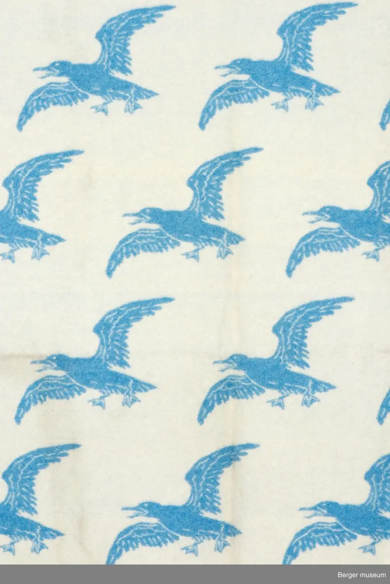 Pledd med måkemotiv