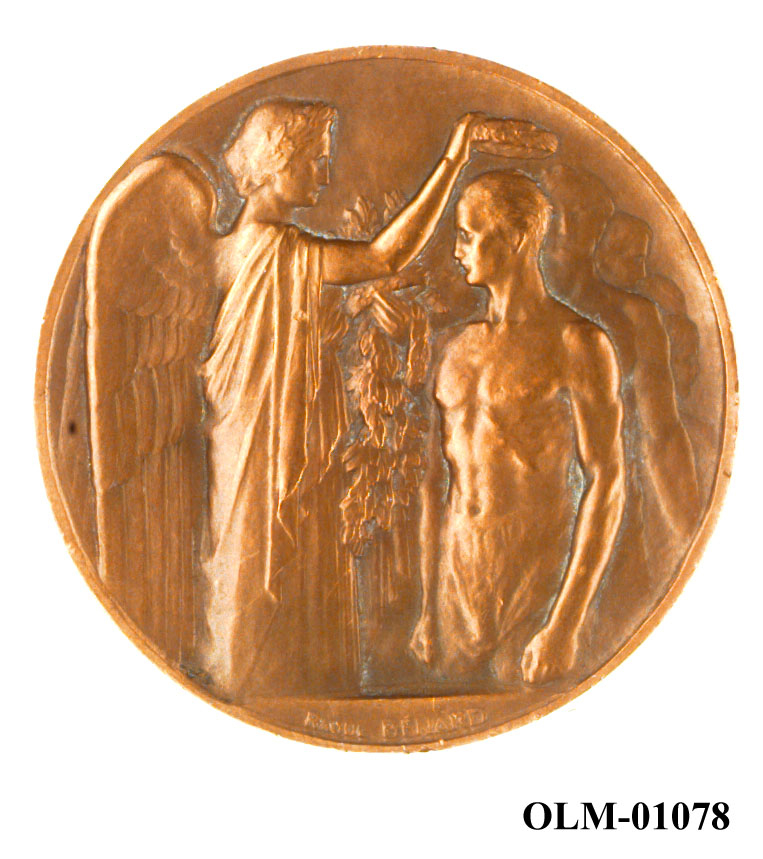 32 forskjellige medaljer og merker i ramme.
Bilde 7 er deltdagermerke fra Amsterdam 1928.
Bilde 18 og 19 er deltagermedalje fra Amsterdam 1928.
Bilde 20 og 21 er sølvmedaljen fra Antwerpen 1920.
Bilde 26 og 27 av bronsemedaljen fra Paris 1924.
Bilde 39 og 40 minnemedaljen fra Antwerpen 1920.