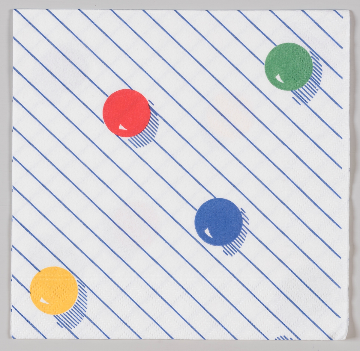 Fire kuler i fargene rød, gul, grønn, blå på en stripet bakgrunn