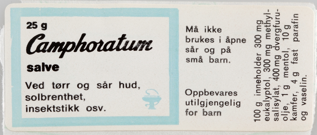 Selvklebende etikett til preparat til utvortes bruk. Dekorert med emblemet til Norges Apotekerforening. Baksiden av etikettene er forsynt med pergamentpapir som beskytter limflaten.