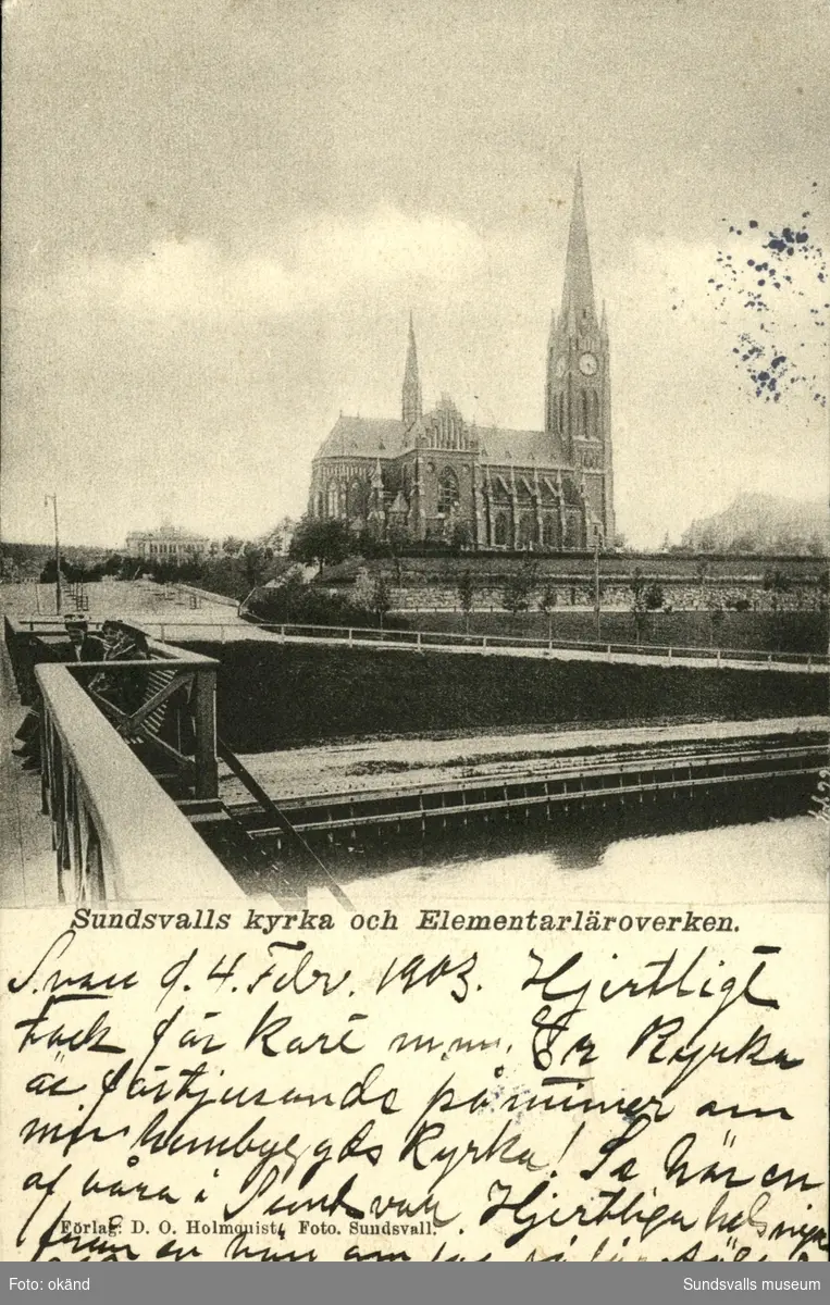 Vykort med motiv över Gustav Adolfs kyrka och Elementärläroverken sett från Storbron.