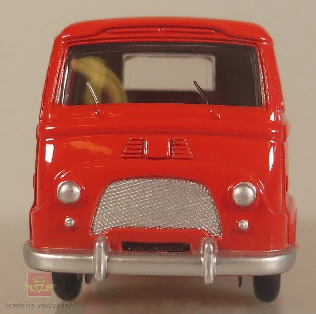 Modellbil av en Renault Estafette, bilen er rød med røde hjulkapsler.