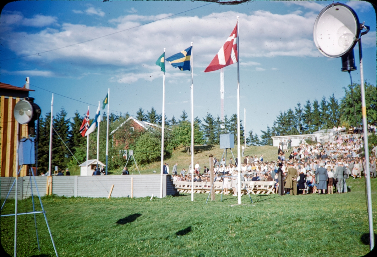 Domkirkeodden, Hamar.  Underholding fra scene, publikum, flagg , nordiske land.Tekst skrevet på dias."Rural youth Festival, july 1949"