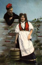 Postkort. Jule- og nyttårshilsen. Kvinne i folkedrakt. Mann