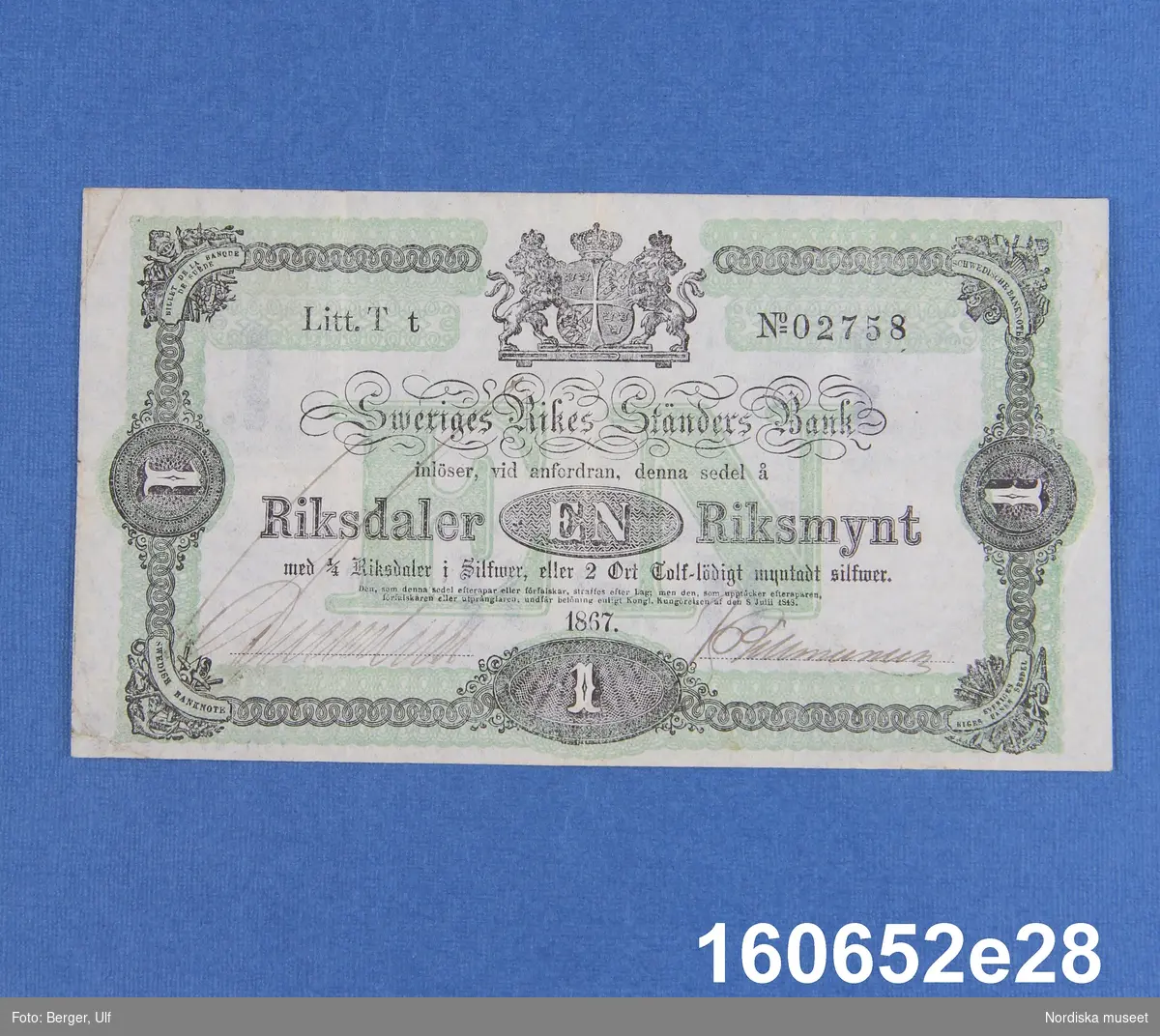 Sveriges Rikes Ständers Bank, 1 riksdaler riksmynt. Daterad 1867, litt T t nr 02758.