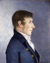 Portrett av Jørgen Aall.  Mann i profil, mørkt, kort hår, kinnskjegg  Mørk blå kledning med to knapper, hvit skjorte. Foto/Photo