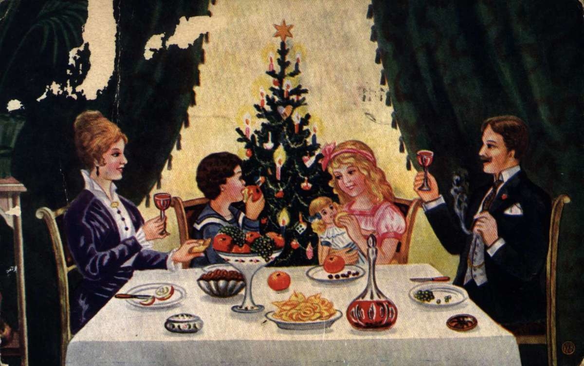 Julekort. Jule- og nyttårshilsen. Familie ved spisebordet. Pyntet juletre i bakgrunnen. Far og mor skåler.  Barna spiser frukt. Stemplet 22.12.1916.