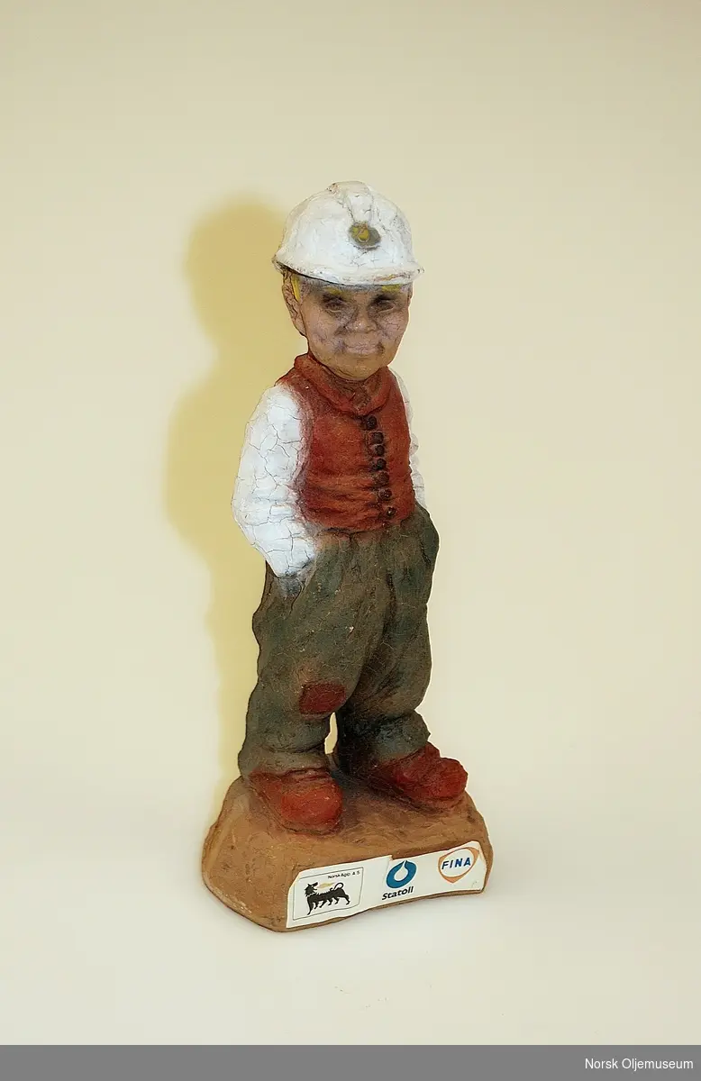 Skulptur av en oljearbeider.