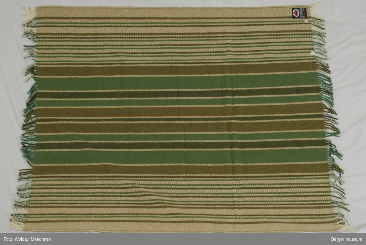 Striper som varierer i bredde. Brede striper inn mot midten og smalere striper ut mot kantene.
Møllsikret