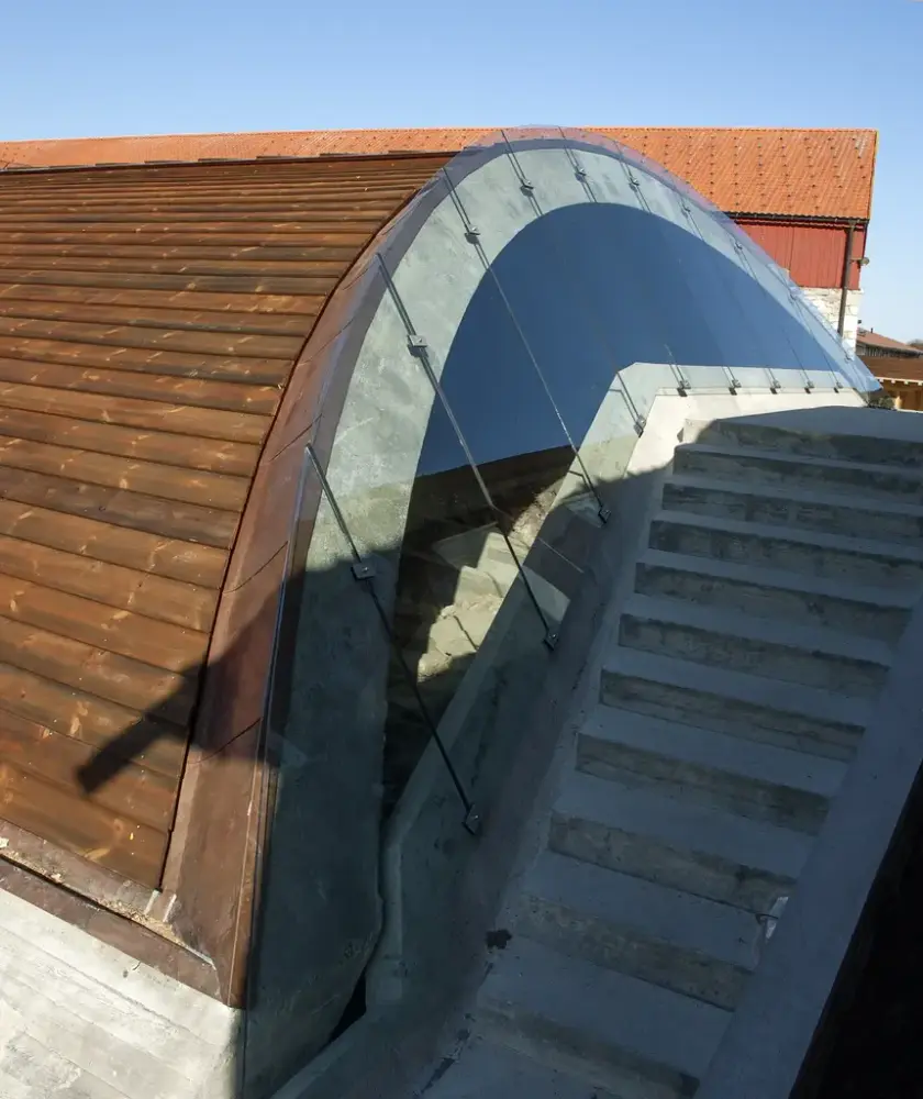 Curved protective construction and a concrete staircase.