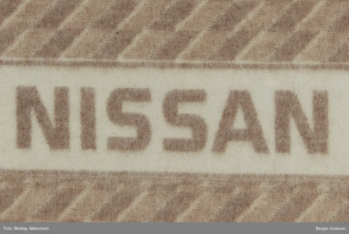 Bilpledd
Små romber
Logo Nissan