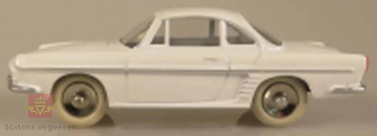 Modellbil av en Renault Floride, modellbilen er hvitfarget med hvite dekk.