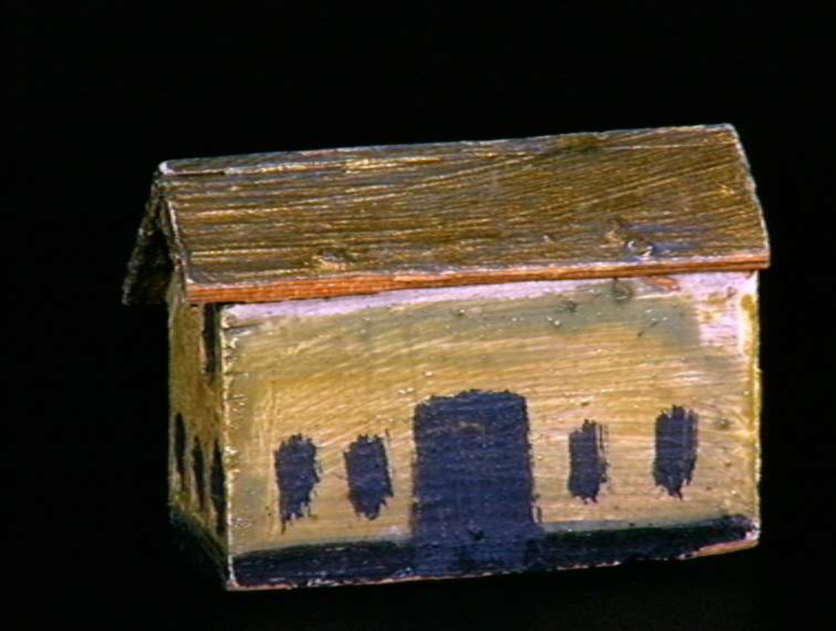 Sett med ca 200 leketøyhus laget av tre i forskjellige former og farger.